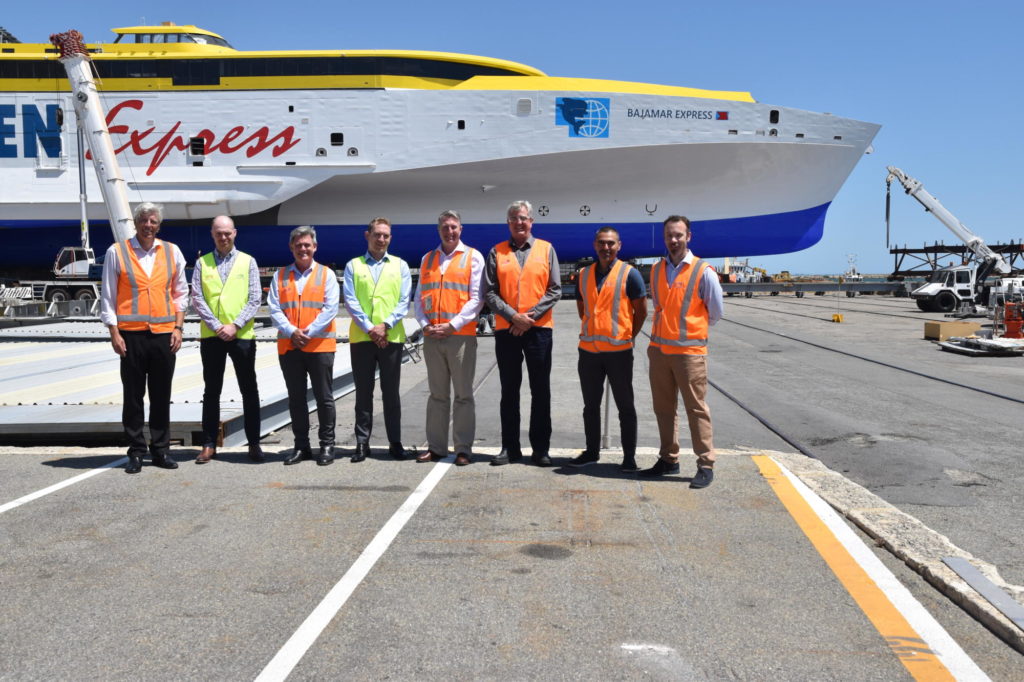 SSI and Austal executives in front of trimaran Bajamar Express